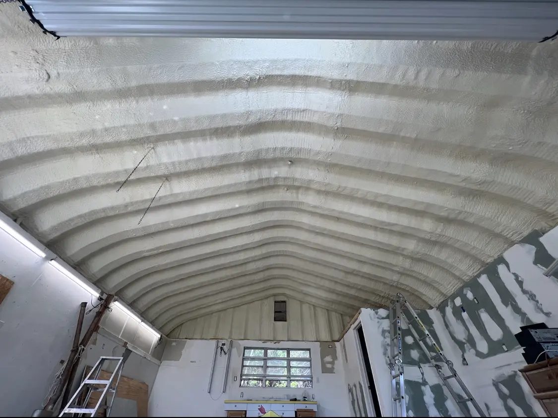 Spray polyurethane foam applied to the underside of a metal roof deck in Jurupa Valley